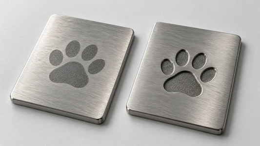 Laser-etched and laser-engraved metal samples with matching paw print designs.
